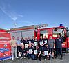 Feuerwehrmänner der Feuerwehr Hochstetten-Dhaun vor einem Einsatzfahrzeug